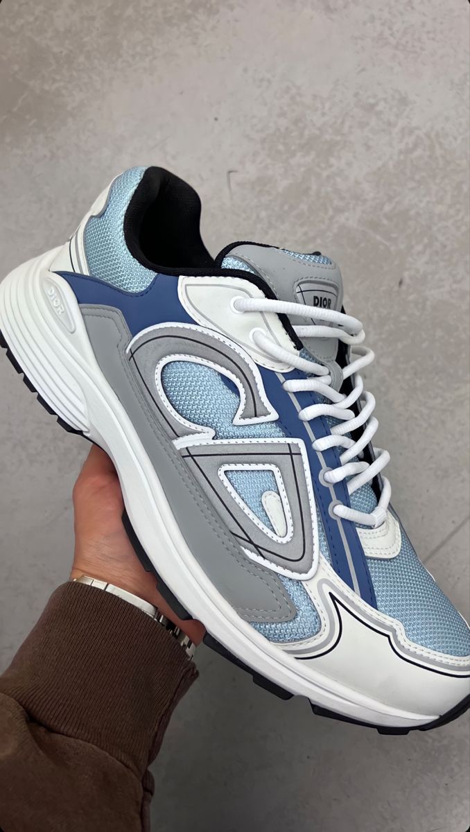 Gray and white sneakers worn by a customer